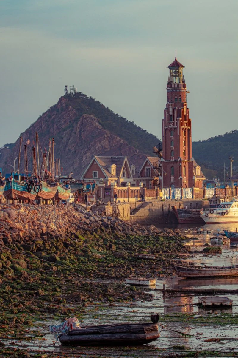 Paint By Numbers | Dalian - Ancient Brown Houses Near Lake Viewing Mountain During Daytime