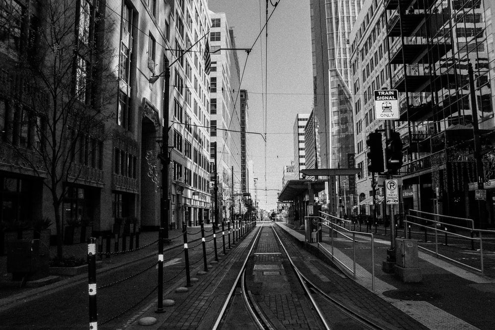Paint By Numbers | Houston - Grayscale Photo Of Train Rail Between Buildings