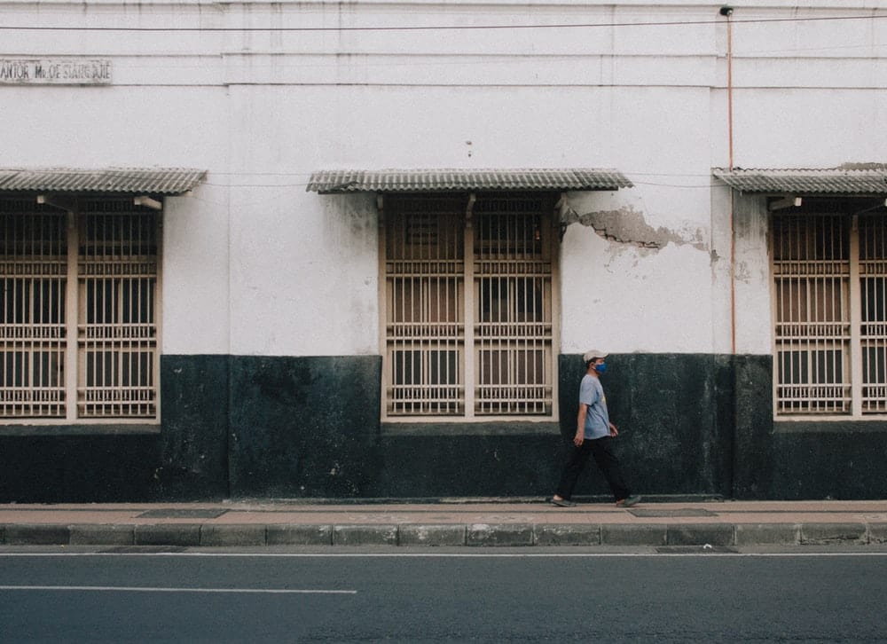 Paint By Numbers | Surabaya - Man In Black Jacket Standing In Front Of White Concrete Building During Daytime