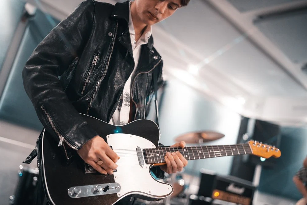 Paint By Numbers | Bass - Man In Black Leather Jacket Playing White Electric Guitar