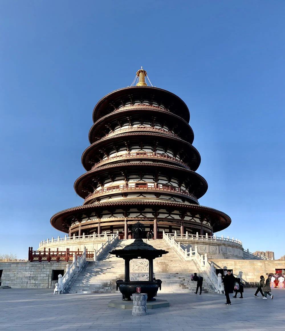 Paint By Numbers | Luoyang - People Walking On Gray Concrete Pathway Near Brown And White Concrete Building During Daytime