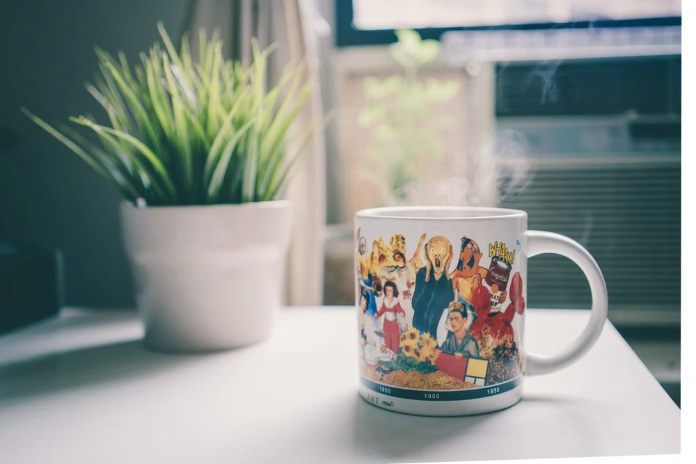 Paint By Numbers | Edvard Munch - Shallow Focus Photography Of White Ceramic Mug Beside Green Leafed Plant