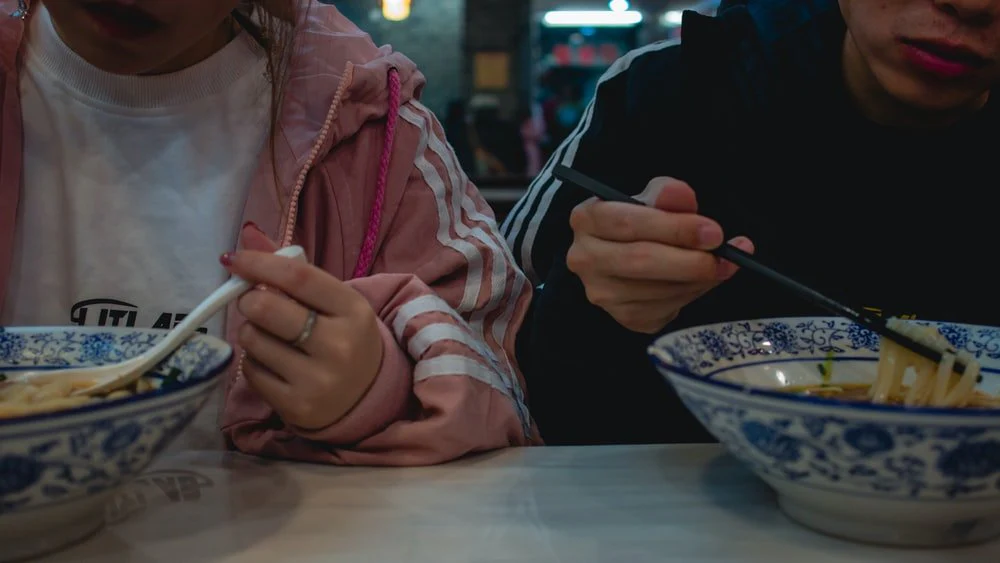Paint By Numbers | Changsha - Woman In Black Jacket Holding Baby In Pink And White Stripe Hoodie