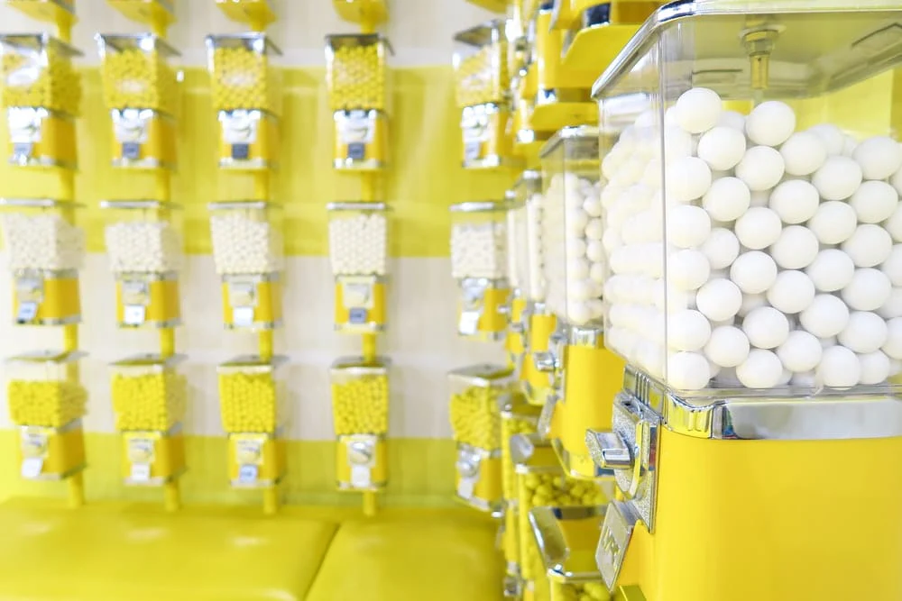Paint By Numbers | Yellow Candy Dispenser Filled With White Candies